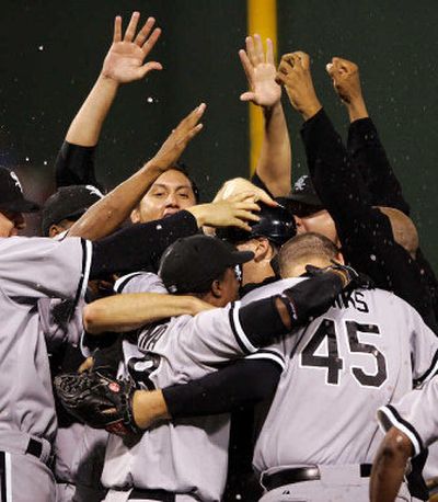 
The Chicago White Sox celebrate after sweeping the Red Sox to win their A.L. Division Series in Boston on Friday. 
 (Associated Press / The Spokesman-Review)