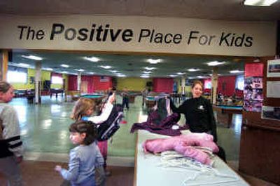 It's 3 p.m., and kids arrive at the Spokane Boys and Girls Club on East Providence Avenue. Kacie Ciske, right, helps put away backpacks and coats as kids head to activities.
(Christopher Anderson/ / The Spokesman-Review)