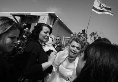 
Israeli-Druse bride Arwad Abushahen, 25,   bids farewell to relatives at the last Israeli checkpoint before the U.N. buffer zone at the Kuneitra Crossing in the Golan Heights on Monday. 
 (Associated Press / The Spokesman-Review)