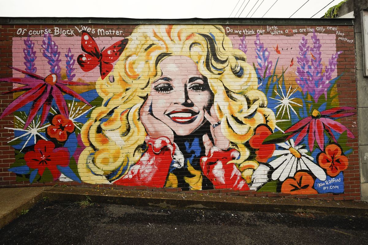 A mural of Dolly Parton is seen outside The 5 Spot, a music club in Nashville, Tenn., Friday, Aug. 21, 2020. Artist Kim Radford said Dolly fans from around the world have contacted her about the mural, which contains a quote from Parton about her support for the Black Lives Matter movement.  (Mark Humphrey)