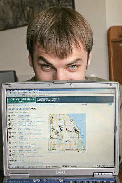 
Adrian Holovaty shows his Web site which lists sites of crimes reported in Chicago, at his apartment in Chicago. Holovaty's site takes data from the Chicago Police Department Web site and creates an archive searchable by date, street, type of crime or other variables. 
 (Associated Press / The Spokesman-Review)