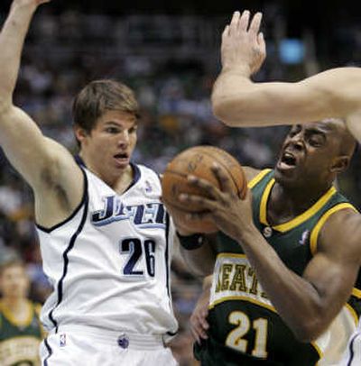 
SuperSonics guard Damien Wilkins, right, attempts to get past Utah's Kyle Korver. Associated Press
 (Associated Press / The Spokesman-Review)