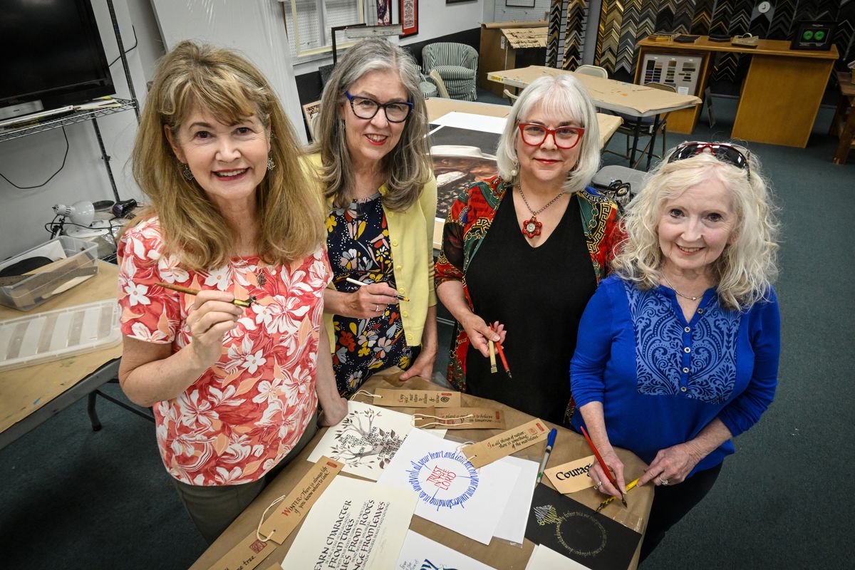 Spokane Calligraphy Guild’s Linda Schneider, left, Cynthia Moore, Shelby Barrentine and Vicki Hall gather recently at Spokane Art Supply.  (Jesse Tinsley/THE SPOKESMAN-REVIEW)