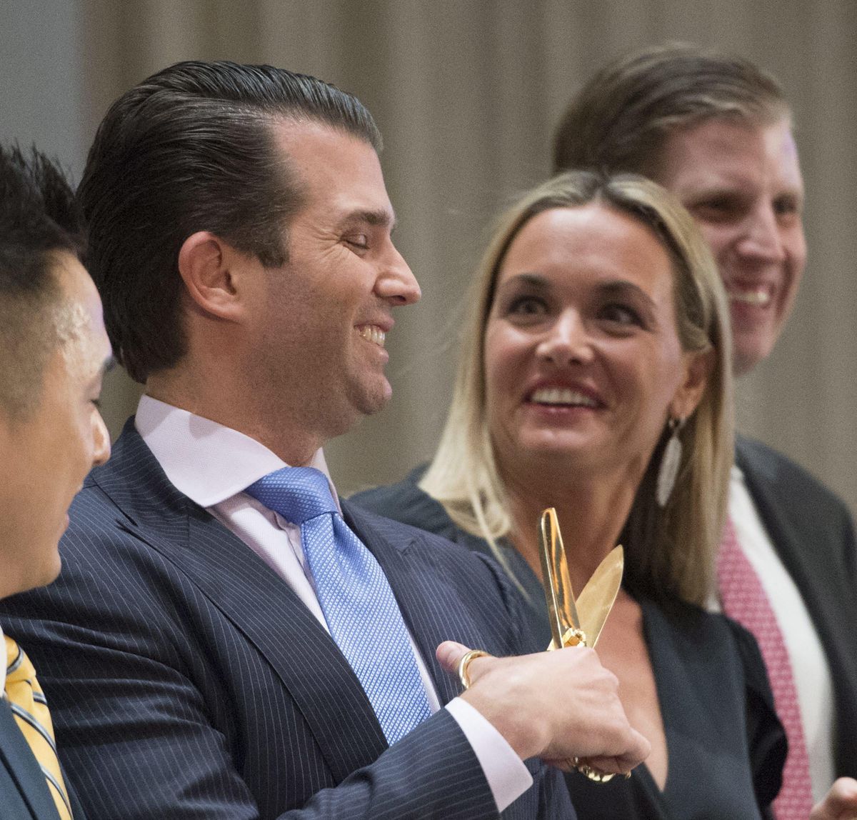 In this Feb. 28, 2017 file photo, Donald Trump Jr. jokingly plays with scissors as his wife Vanessa laughs at the grand opening of the Trump International Hotel and Tower in Vancouver, Canada. A public court record filed Thursday, March 15, 2018 in New York says Vanessa Trump is seeking an uncontested divorce from the president’s son. Details of the divorce complaint haven’t been made public. (Jonathan Hayward / Associated Press)
