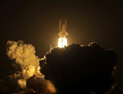 Space shuttle Discovery lifts off  at Kennedy Space Center in Cape Canaveral, Fla., on Sunday.  (Associated Press / The Spokesman-Review)