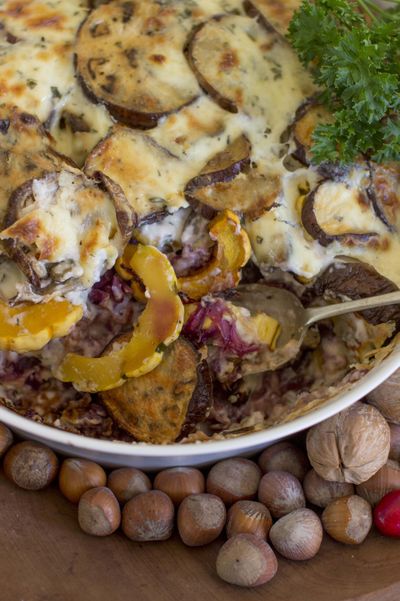 This photo shows Thanksgiving eggplant strata in Concord, N.H. The deliciously creamy strata marries layers of roasted eggplant, delicata squash and red cabbage with a rich bechamel sauce. (Associated Press)