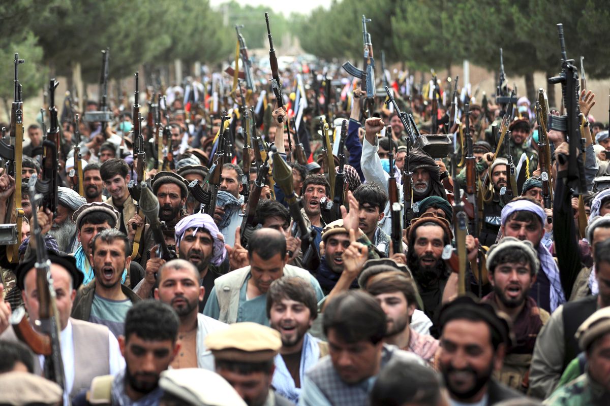 Afghan militiamen join Afghan defense and security forces during a gathering in Kabul, Afghanistan, on June 23.  (Rahmat Gul)