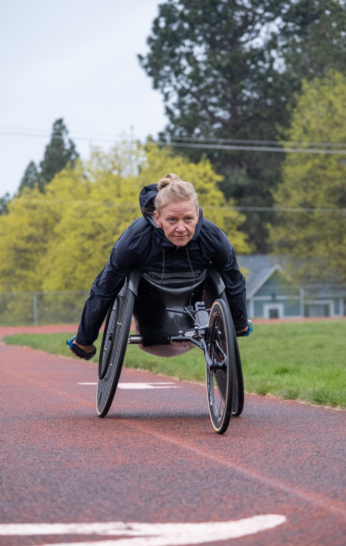 Tekoa native Susannah Scaroni pushes down the track during a practice session on Saturday, April 30, 2022, at Valley Christian School in Spokane Valley, Washington. Scaroni is the defending Bloomsday women