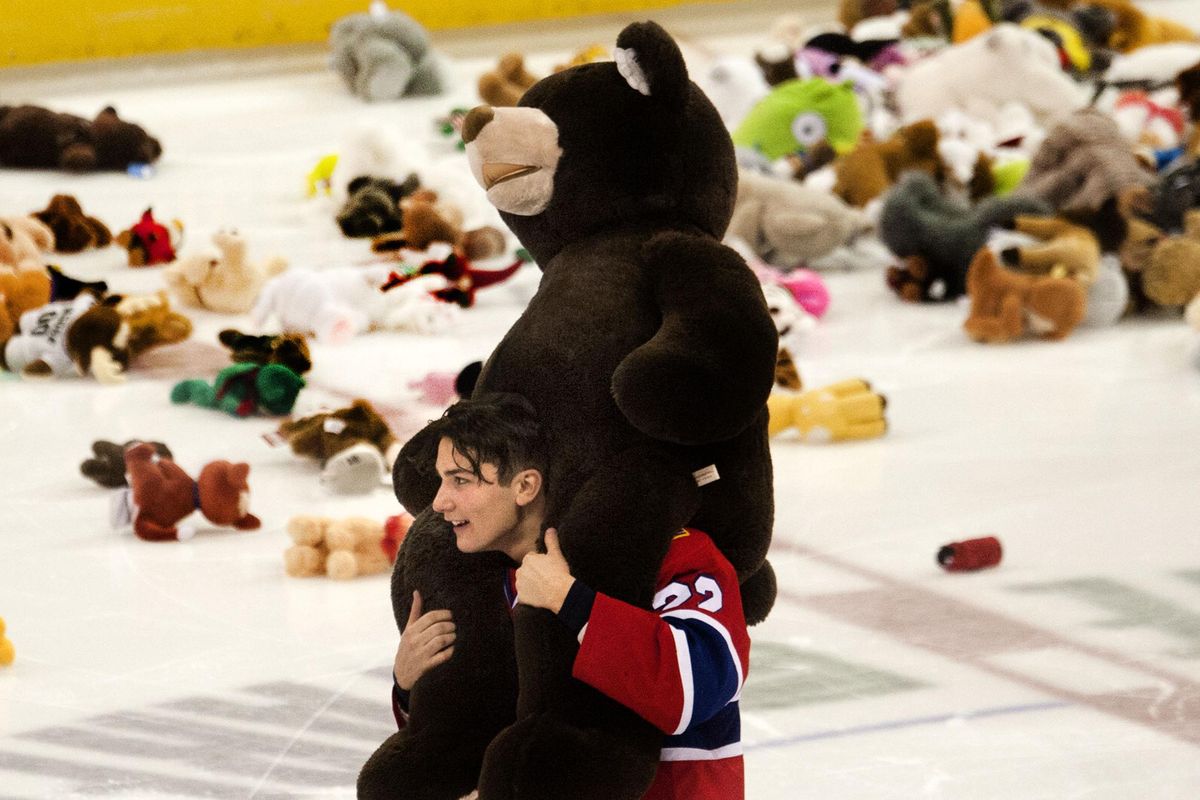 Spokane Chiefs forward  Luke Toporowski carries a teddy bear at the Teddy Bear Toss, sponsored by 
The Spokesman-Review Christmas Fund, on Saturday night.  The  bears will be given to needy children. (Kathy Plonka / The Spokesman-Review)