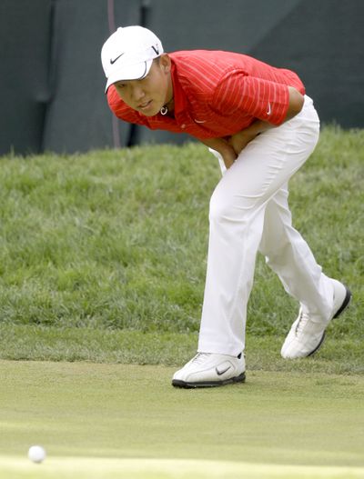 Anthony Kim watches as his putt comes up short on the 17th hole.  (Associated Press / The Spokesman-Review)