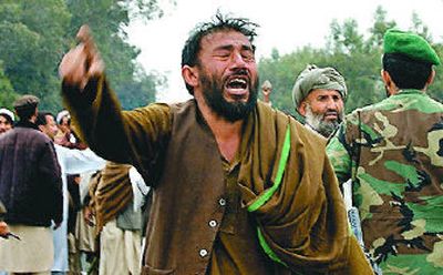 
A man weeps as he shouts anti-American slogans Sunday in Barayekab, eastern Afghanistan. 
 (Associated Press / The Spokesman-Review)