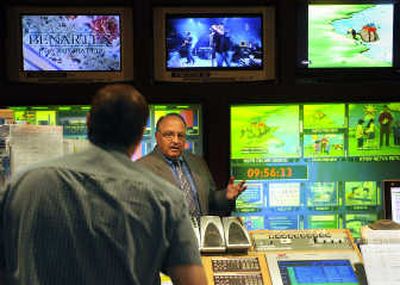 KSPS station manager Claude Kistler, center,  talks with Randy Kenworthy  in the master control room at the South Hill station on Wednesday. 
 (Dan Pelle / The Spokesman-Review)