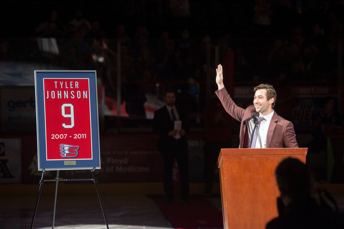 Former Spokane Chiefs great Tyler Johnson waves to the crowd after he was introduced at the game where his number was retired Friday, Feb. 4, 2022 at the Spokane Arena.  (JESSE TINSLEY)