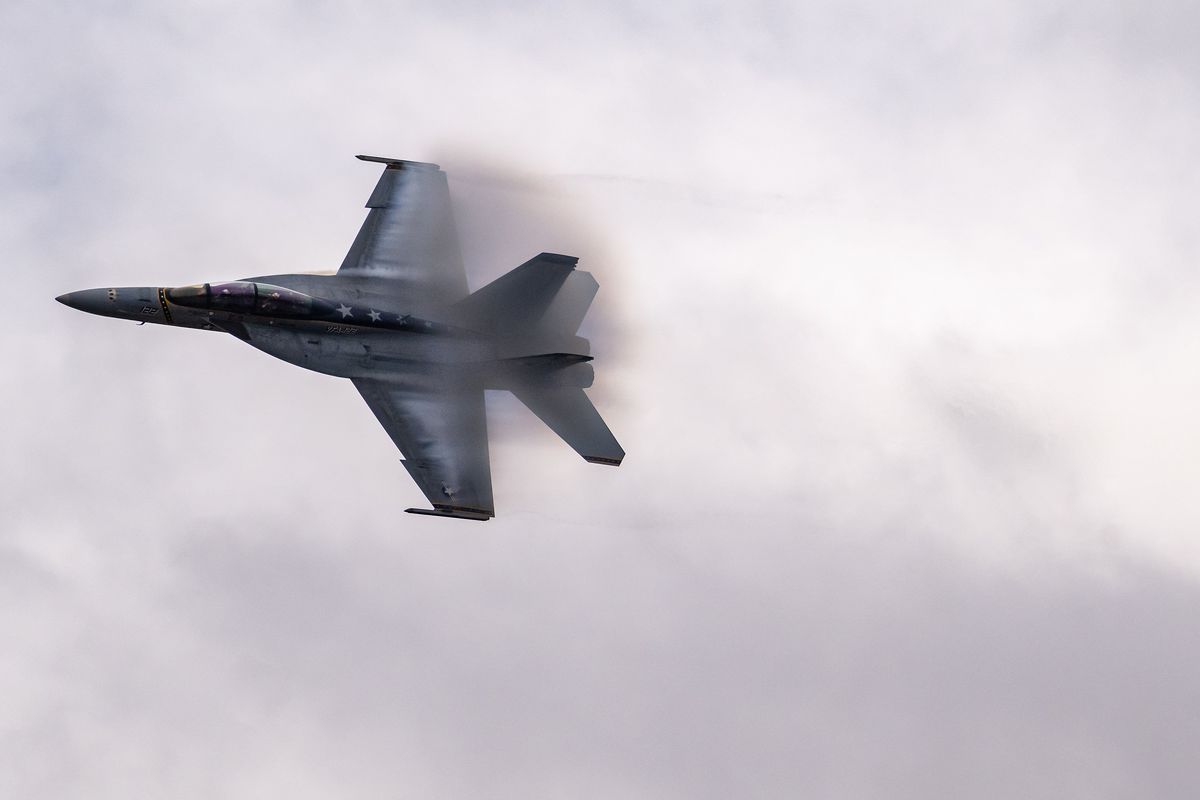 An US Navy F-18 Demo Team pilot performs low altitude maneuvers for the crowd gathered during SkyFest, Saturday, May 14, 2022, at Fairchild Air Force Base.  (COLIN MULVANY/THE SPOKESMAN-REVI)