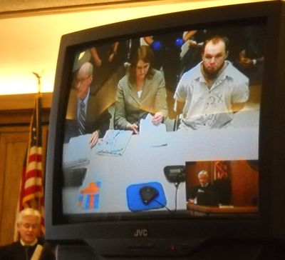 Michael L. West, convicted of killing his jail cellmate in 2004, appears before Spokane County Superior Court Judge Michael Price on Jan. 19, 2011. West is charged with two counts of assault for an alleged attack on his cellmates at Airway Heights Corrections Center in 2010. Public defender Kari Reardon and Deputy Prosecutor Larry Steinmetz are seated to West's left. (Meghann M. Cuniff / The Spokesman-Review)