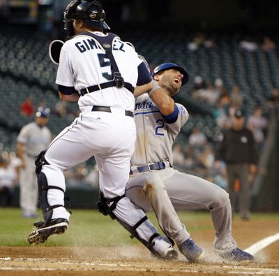 Seattle Mariners' catcher Chris Gimenez, left, tags out Kansas City Royals' Jeff Francouer at home on a fielders choice in the second inning, during a baseball game in Seattle, on Thursday, Sept. 8, 2011. (Kevin Casey / Fr132181 Ap)