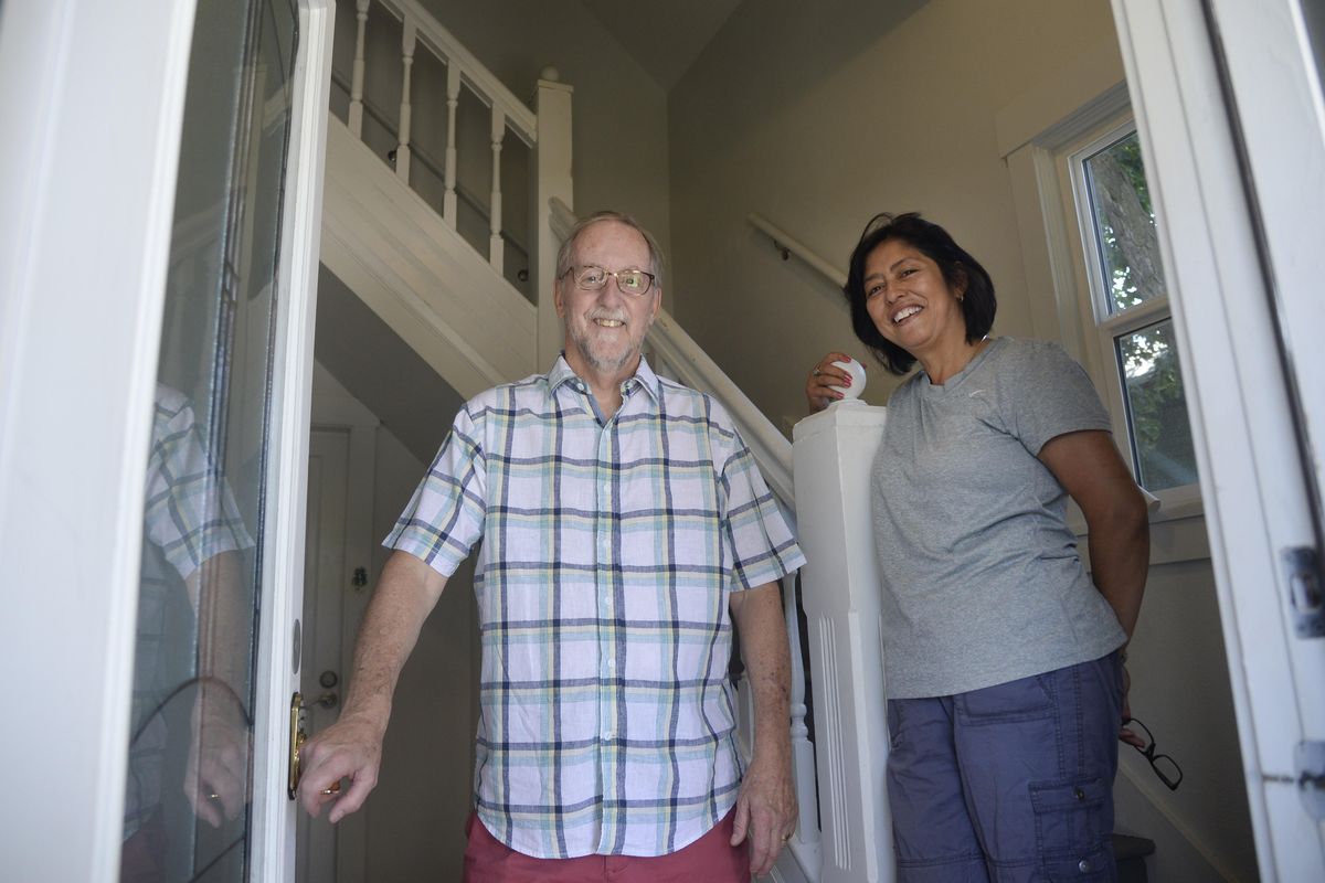 Brian and Sandra Jones stand in the vestibule of an older West Central home that’s been divided into a duplex, which they have refurbished and rented out. The couple have invested in a handful of rental properties and have no trouble filling them with tenants because of the tight rental market in the Spokane area. (Jesse Tinsley / The Spokesman-Review)