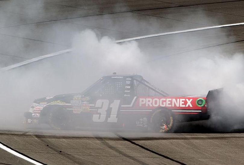James Buescher performs a burnout after getting his first career win in the NASCAR Camping World Truck Series SFP 250 on Saturday at Kansas Speedway in Kansas City, Kan. (Photo Credit: Jamie Squire/Getty Images) (Jamie Squire / Getty Images North America)