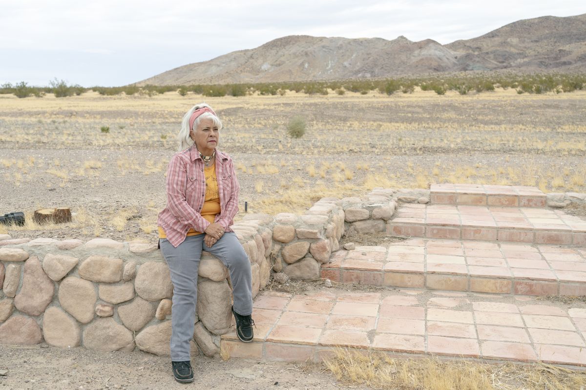 Roberta Walker, the woman on whom the Donna Jensen character from “Erin Brockovich” was based, sits on the steps of her former home in Hinkley, Calif., on Nov. 25.  (Kyle Grillot/For The Washington Post)