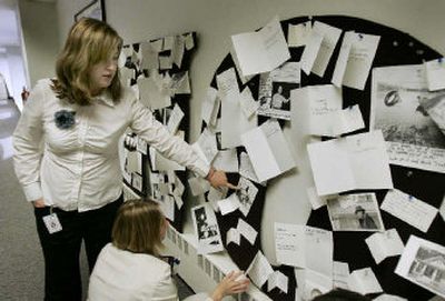 
Maureen Gowen and Jessica Ong look at rejected card ideas at Hallmark in Kansas City, Mo. The card ideas posted are funny, but didn't make the final cut. 
 (Associated Press / The Spokesman-Review)