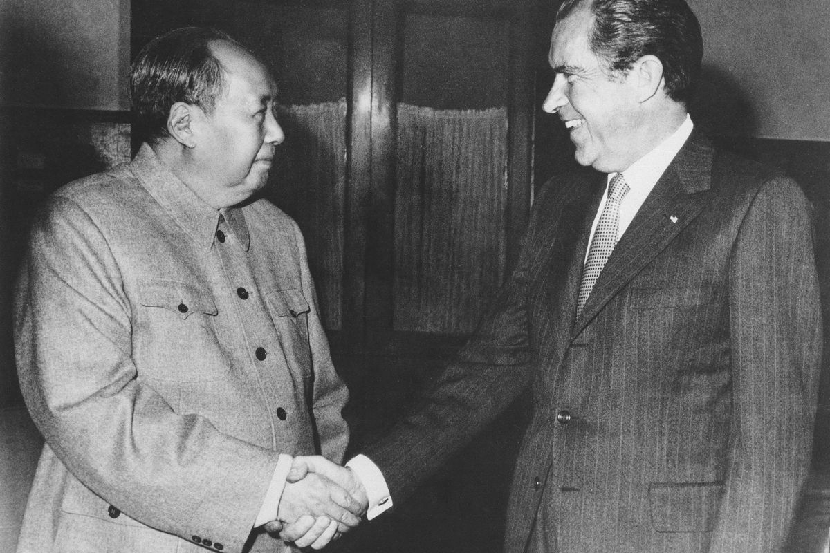 FILE - Then Chinese communist party leader Mao Zedong, left, and then U.S. President Richard Nixon shake hands as they meet in Beijing on Feb. 21, 1972. At the height of the Cold War, U.S. President Richard Nixon flew into communist China