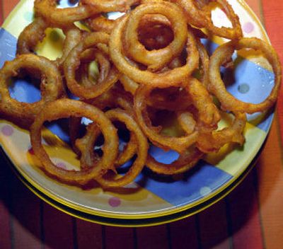 
Pile them on your favorite grilled meat, onion rings will add a whole new dimension to your meal.
 (TPN / The Spokesman-Review)