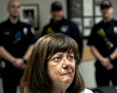 Penny Landrey, 70, is overcome with emotions after meeting with first responders Tuesday at the Post Falls Police Station in Idaho. Landrey was shot in the head by an ex-boyfriend at her home in February.  (Brian Plonka photo / brianp.onfa)