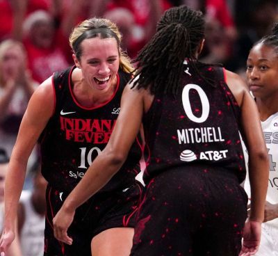 Indiana Fever’s Lexie Hull, left, and Kelsey Mitchell celebrate during Sunday’s Game 4 in Indianapolis.  (Christine Tannous/USA TODAY)