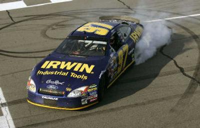 
NASCAR racer Kurt Busch spins donuts after winning the Pennsylvania 500. 
 (Associated Press / The Spokesman-Review)