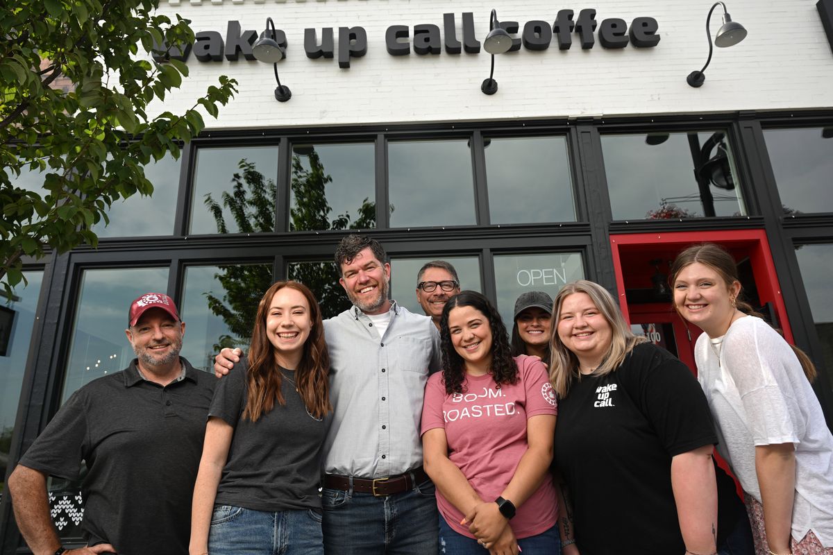 The company team at Wake Up Call Coffee pose at their Union District cafe store at 1722 E. Sprague Ave. in Spokane. From left are Mike Thomas, Courtney True, owner Christopher Arkoosh, Tom Gresch, Ashley Hopkins, Corinne Sanborn, Addison Nelson and McKenna Arkoosh.  (Jesse Tinsley/THE SPOKESMAN-REVIEW)