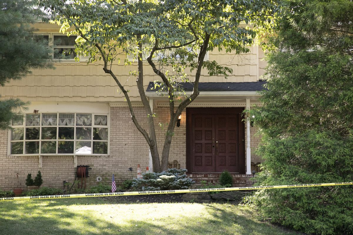 Crime scene tape surrounds the home of U.S. District Judge Esther Salas, Monday, July 20, 2020, in North Brunswick, N.J. A gunman posing as a delivery person shot and killed Salas