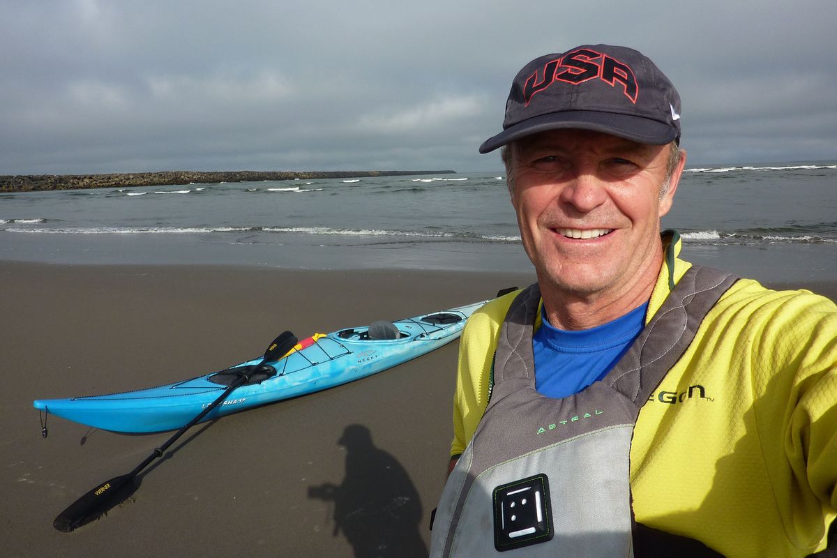 John Roskelley of Spokane prepares to launch his kayak on the Columbia River, which he measured at 1,200 miles.