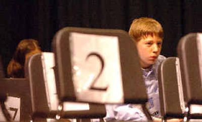 
Matt Harlow tries to stay focused as the chairs around him begin to empty out rapidly in the second round of the North Idaho Regional Spelling Bee in March, at North Idaho College. 
 (File/ / The Spokesman-Review)