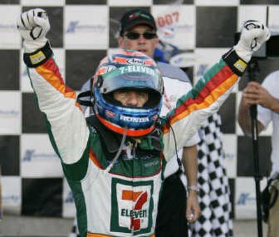 
Tony Kanaan gestures to the crowd after winning the IRL Meijer Indy 300 at Kentucky Speedway on Saturday.Associated Press
 (Associated Press / The Spokesman-Review)