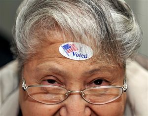 Dora A. Winter of Nampa, looks up after an "I Voted" sticker was placed on her forehead at Karcher Church of the Nazarene on Election Day, Tuesday, Nov. 6, 2012 in Nampa, Idaho. (AP/Idaho Press-Tribune / Adam Eschbach)