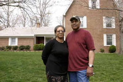 
James and Nealie Pitts stand outside their home in Richmond, Va., in March. Nealie Pitts was looking for a house in 2002 and approached Richmond resident Rufus T. Matthews. According to court documents, Matthews told her the house's selling price was $83,000 – and for whites only. 
 (Associated Press / The Spokesman-Review)