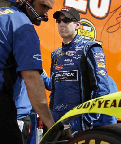 
Kyle Busch waits while his team prepares car for practice Friday. 
 (Associated Press / The Spokesman-Review)