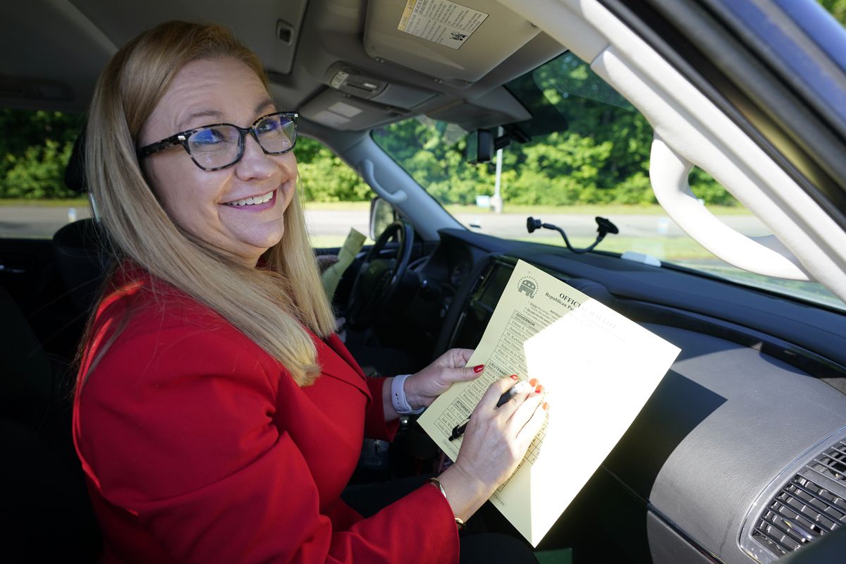 Republican gubernatorial candidate State Sen. Amanda Chase, fills out her ballot during a drive through GOP Convention vote in Chesterfield, Va., Saturday, May 8, 2021.  (Steve Helber)