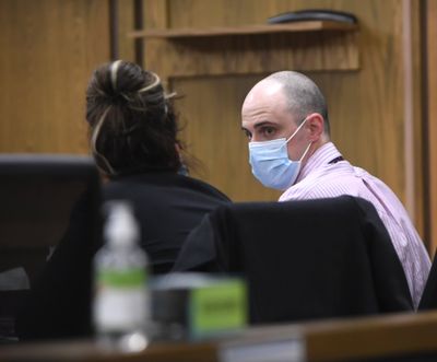 Nathan Beal, convicted of killing his ex-wife in August 2020, talks with his attorney Feb. 23 in Spokane Superior Court on the first day of his murder trial.  (Jesse Tinsley/The Spokesman-Review)