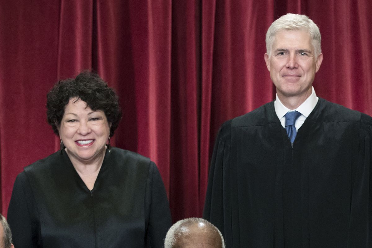 FILE - Associate Justice Sonia Sotomayor, left, and Associate Justice Neil Gorsuch, gather with other justices of the U.S. Supreme Court for an official group portrait, June 1, 2017, at the Supreme Court Building in Washington.  (J. Scott Applewhite)