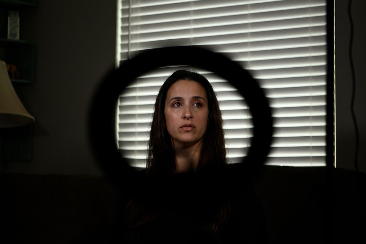 Gina Kuehne with a ring light, which she uses to hold her phone while making product review videos, at her home in Texas.   (Callaghan O