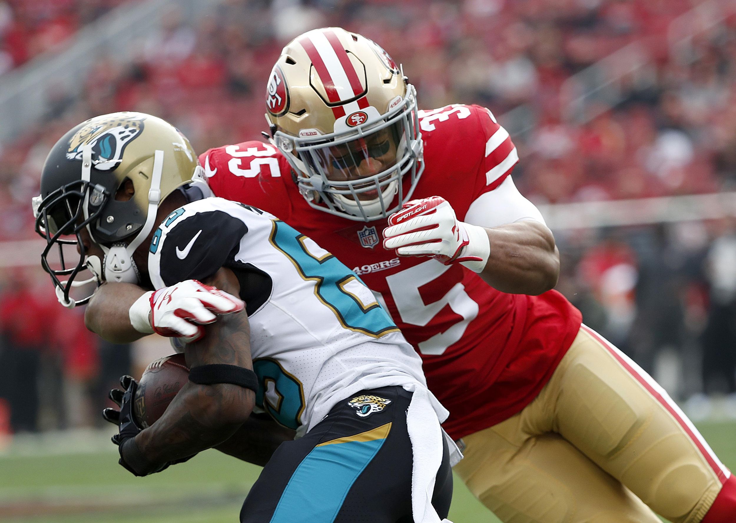 Eric Reid signs with Panthers, back in NFL after protests