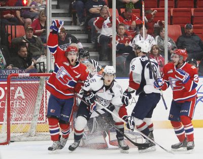 Spokane's Mike Aviani, left, celebrates his goal that gave the Chiefs a 1-0 lead in their game Saturday night at Kennewick. (Kai-Huei Yau)