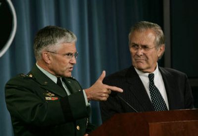 
Defense Secretary Donald  Rumsfeld, right, looks on as Army Gen. George  Casey, the U.S. top commander in Iraq, speaks during their joint news conference Thursday at the Pentagon. 
 (Associated Press / The Spokesman-Review)