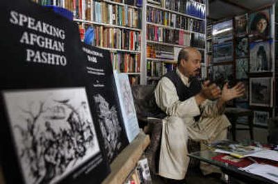 
Afghan bookseller Shah Mohammad Rais gestures during an interview Oct. 2. The famed bookseller of Kabul, whose family life was chronicled by a Norwegian journalist, has published a scathing response to her book, accusing her of concocting lies about him and abusing his hospitality and friendship. Associated Press/Musadeq Sadeq
 (Associated Press/Musadeq Sadeq / The Spokesman-Review)