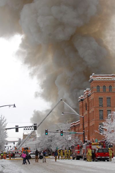 Emergency personnel respond to an explosion on Main Street in Bozeman on Thursday.  (Associated Press / The Spokesman-Review)