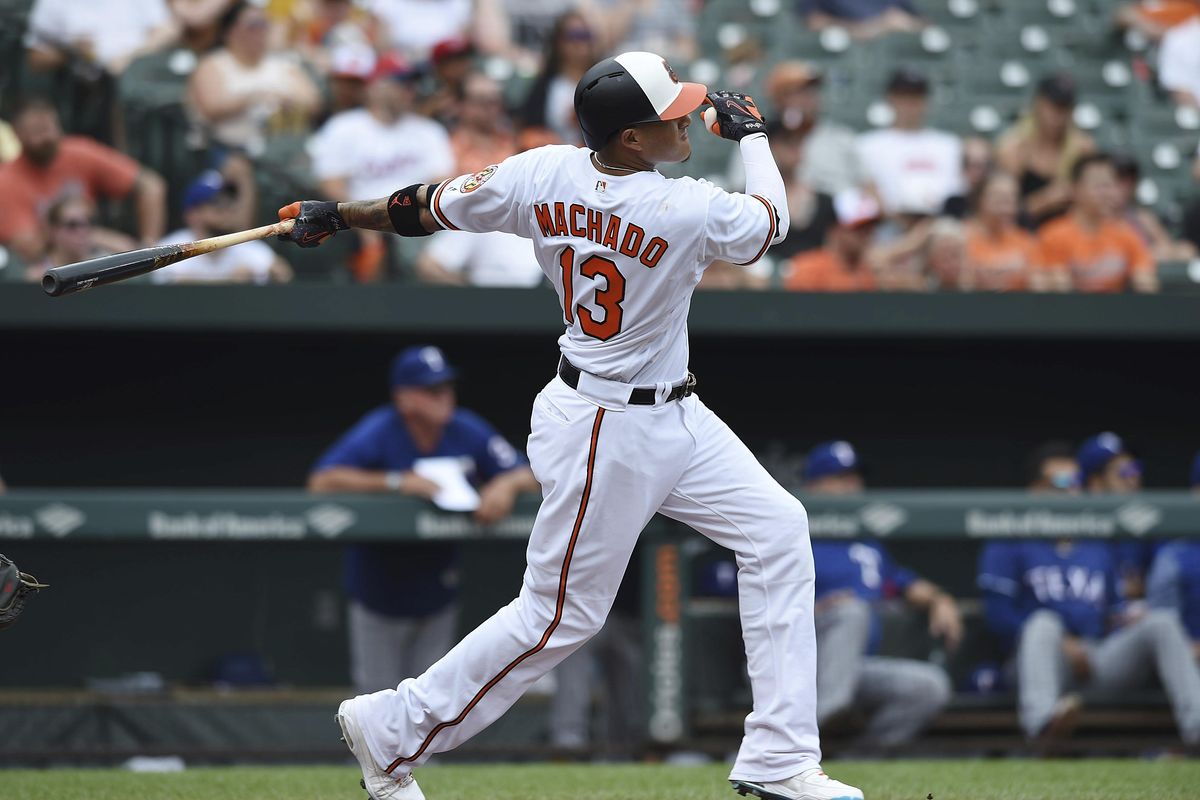 Baltimore’s Manny Machado follows through on a solo home run against the Texas Rangers in the first inning  Sunday in Baltimore. (Gail Burton / AP)