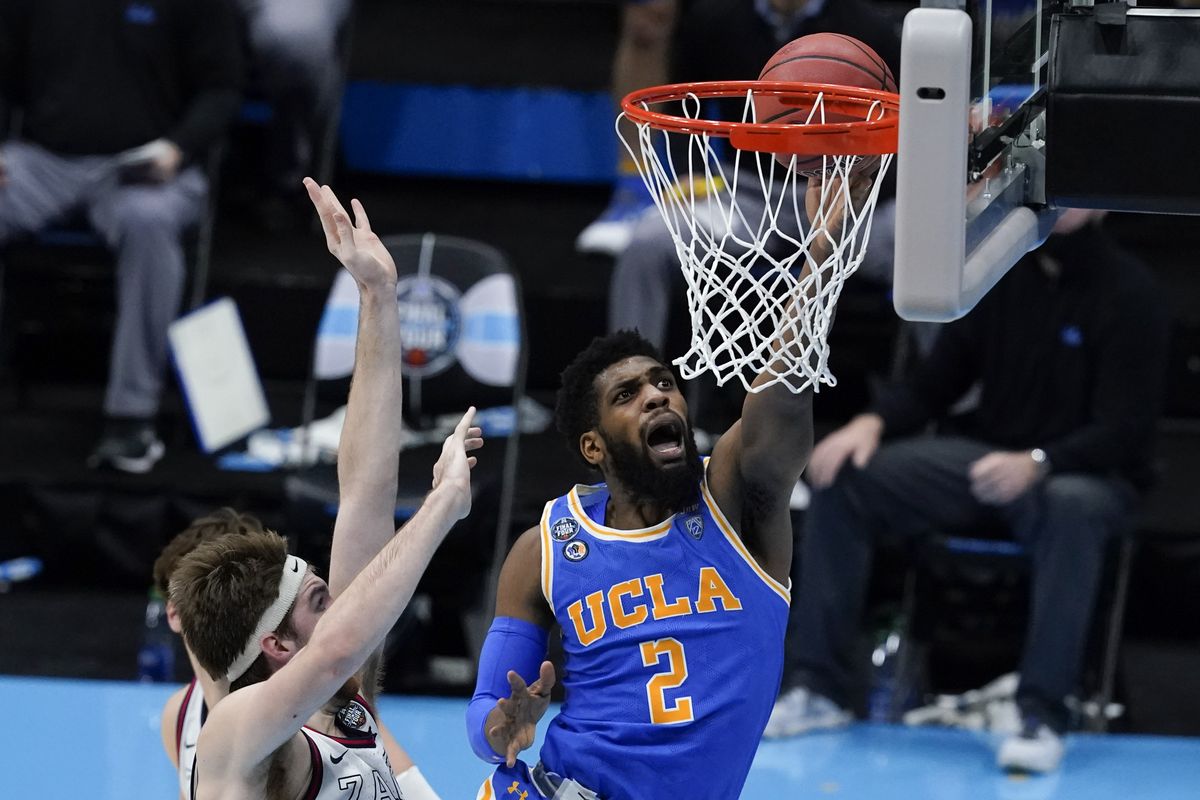 UCLA’s Cody Riley drives past Gonzaga’s Drew Timme during their epic NCAA Tournament semifinal game on April 3 in Indianapolis.  (Associated Press)