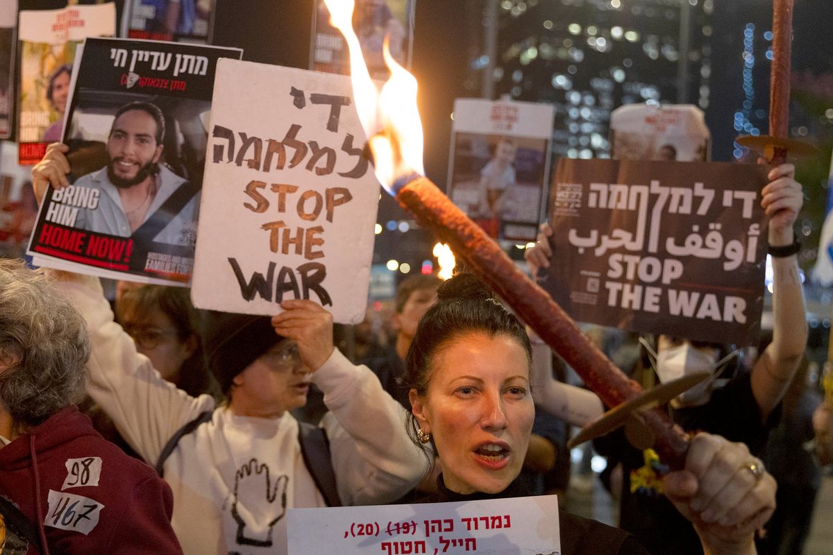 Protesters calling for the return of hostages held in the Gaza Strip react after a Gaza ceasefire and hostage release deal was reached on Jan. 15 in Tel Aviv, Israel. (Amir Levy)