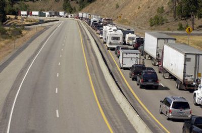 
Traffic on Interstate 90 is backed up near the Mullan Trail Road overpass Sunday after a cattle truck accident. 
 (Tom Davenport/ / The Spokesman-Review)
